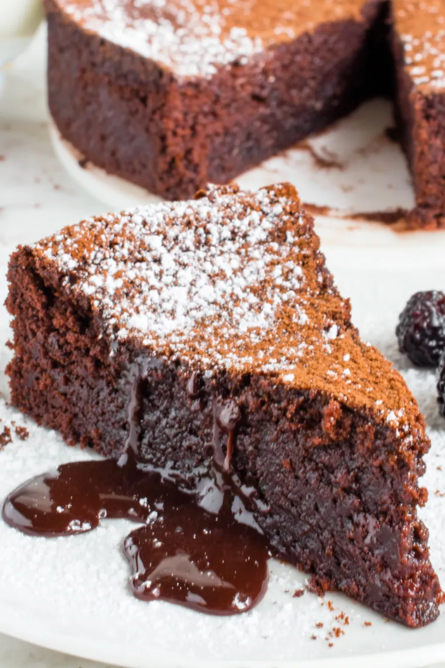 Flourless chocolate cake cooling on a rack