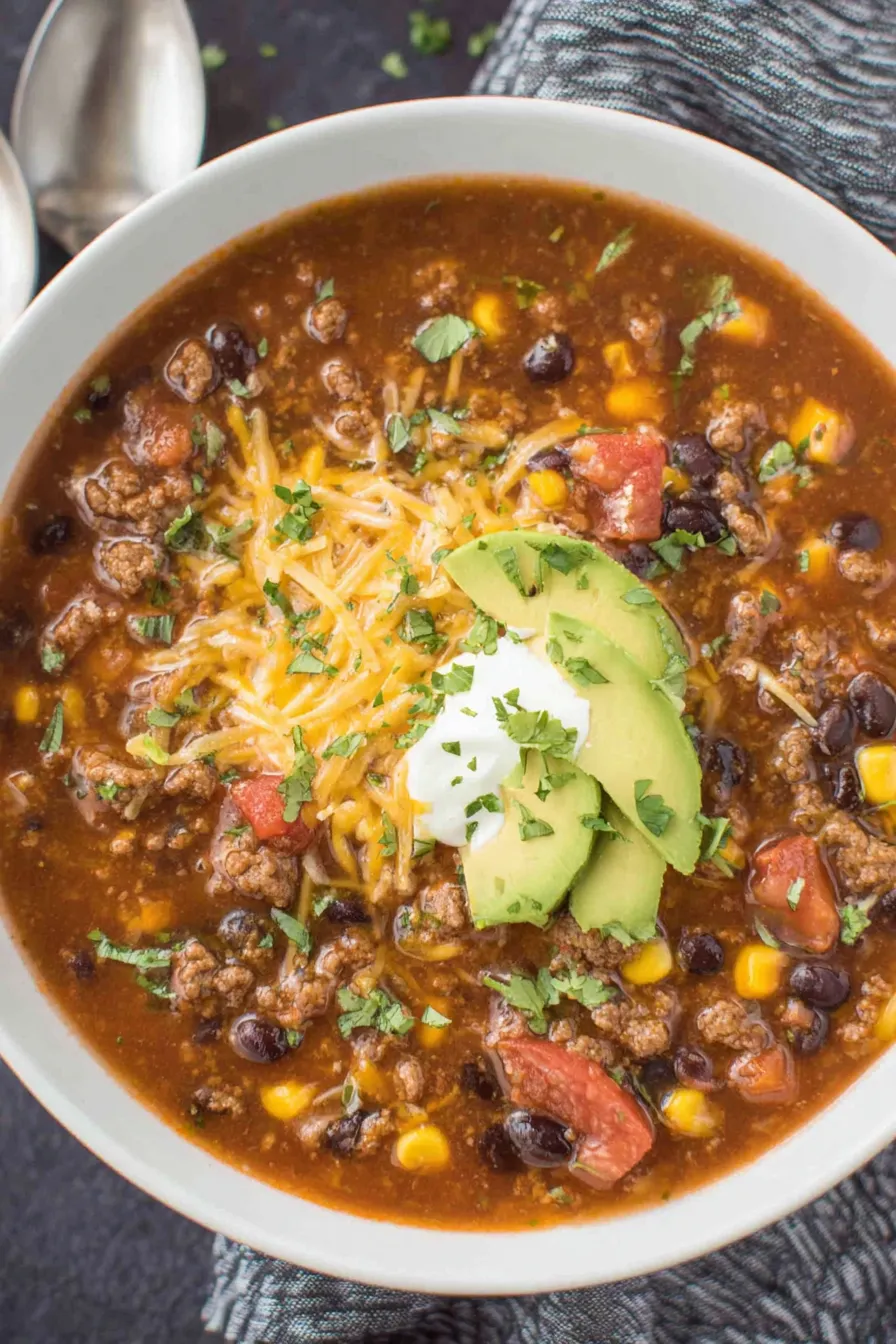 Simmering beef taco soup in a pot