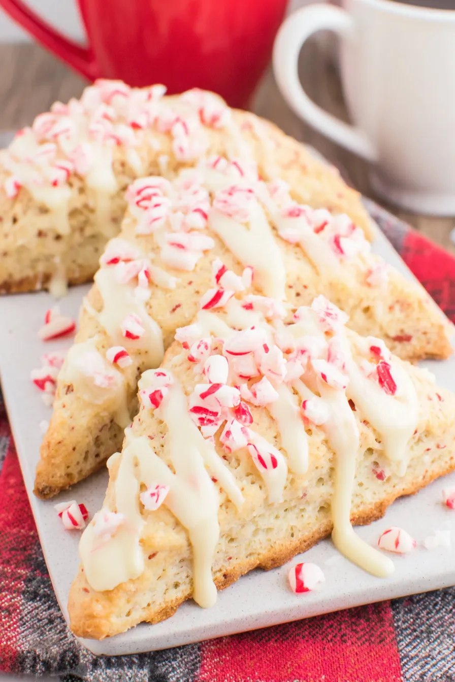 White chocolate being drizzled over peppermint scones