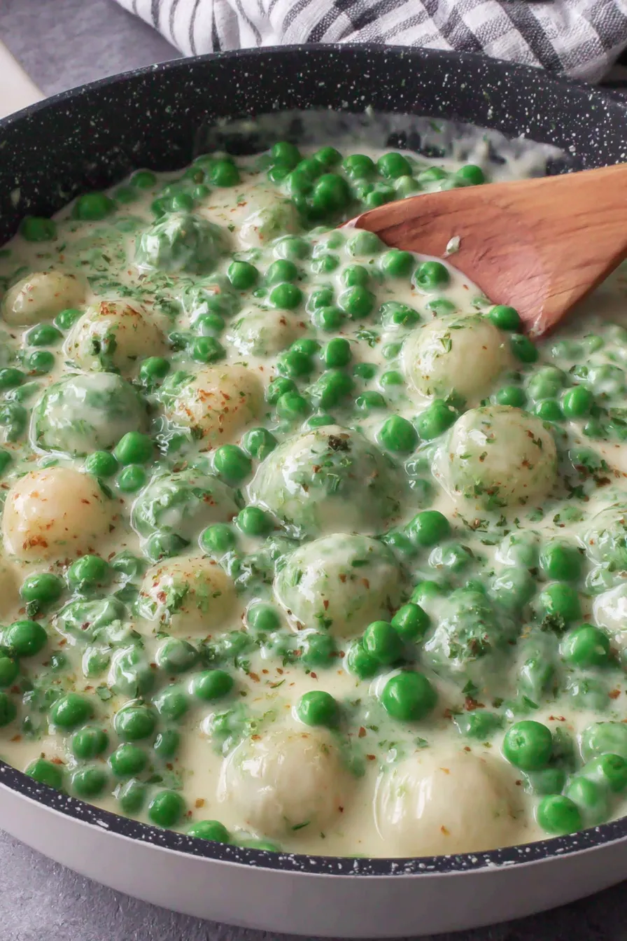 Pearl onions and peas in a bowl