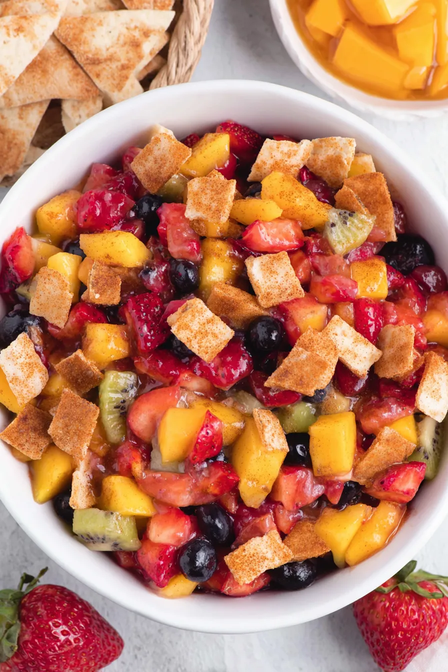 Assorted diced fruit for salsa in a large bowl