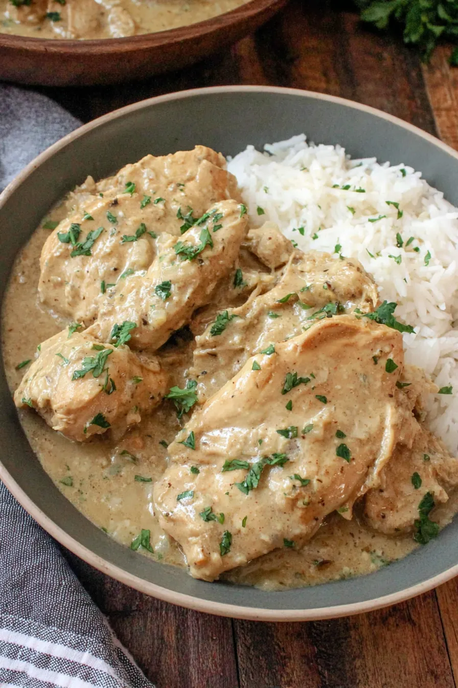 Slow cooker full of chicken and creamy gravy
