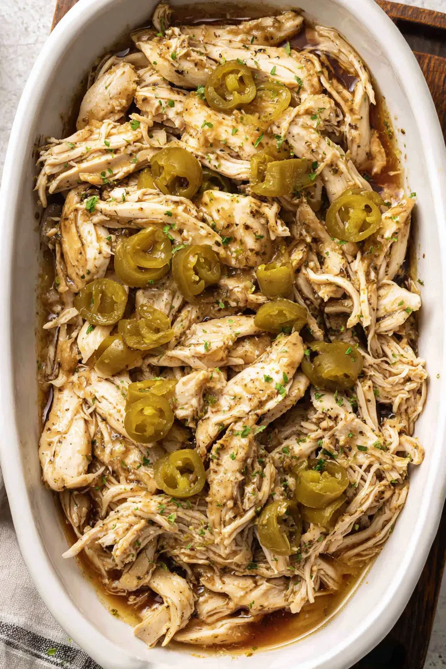 Shredded Mississippi Chicken served on a plate with garnish