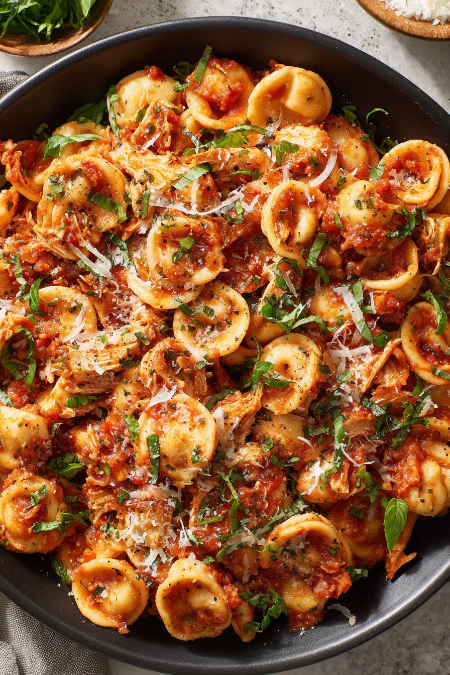 Chicken Fra Diavolo in pot with basil