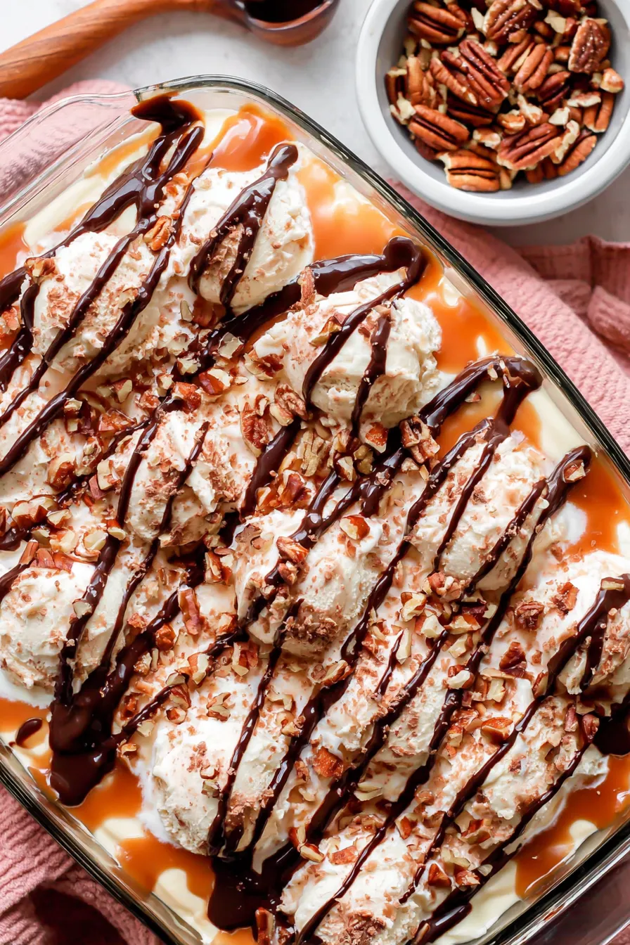 Turtle poke cake with caramel and chocolate drizzle on top