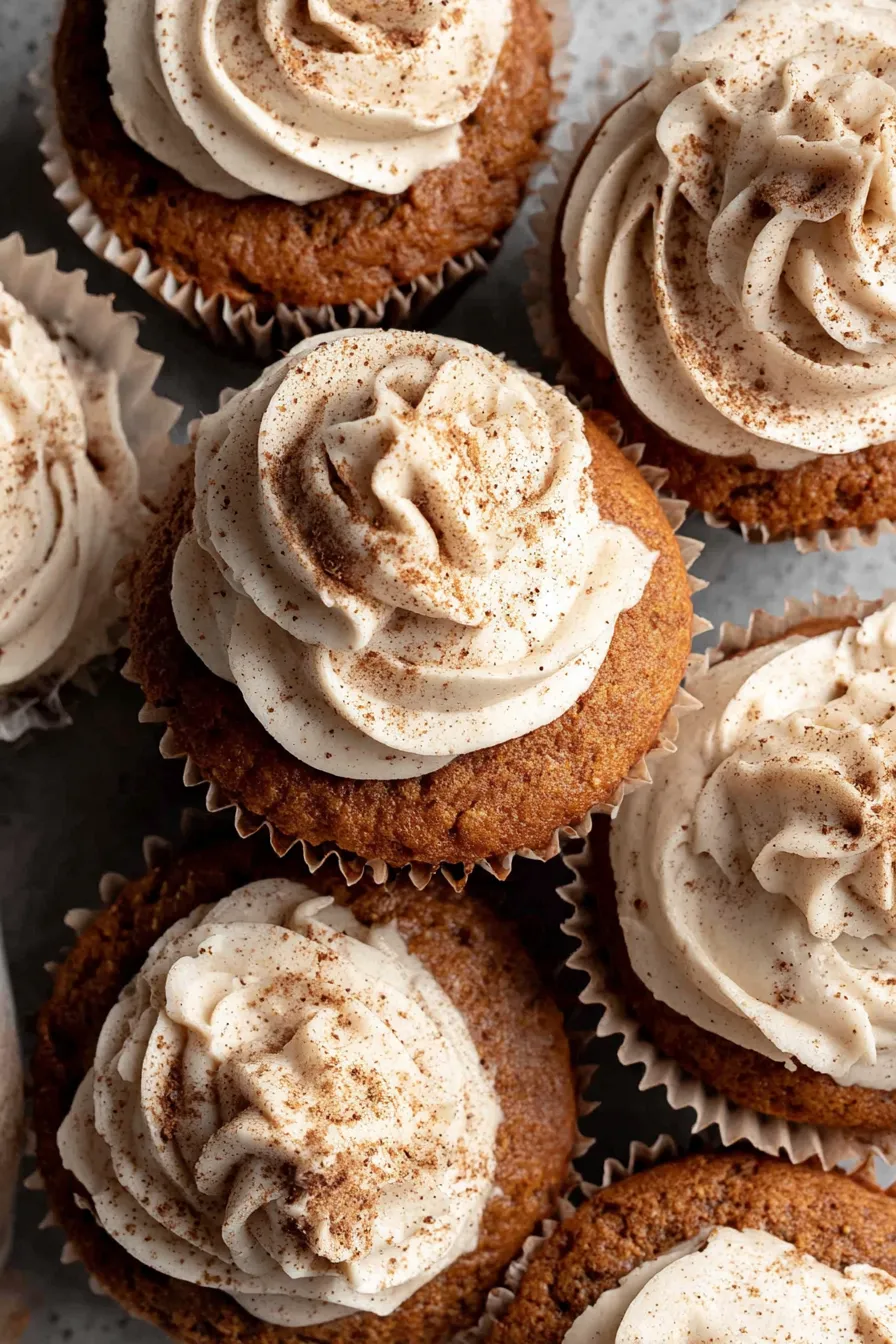 Close up of espresso cream cheese frosting swirled on a cupcake