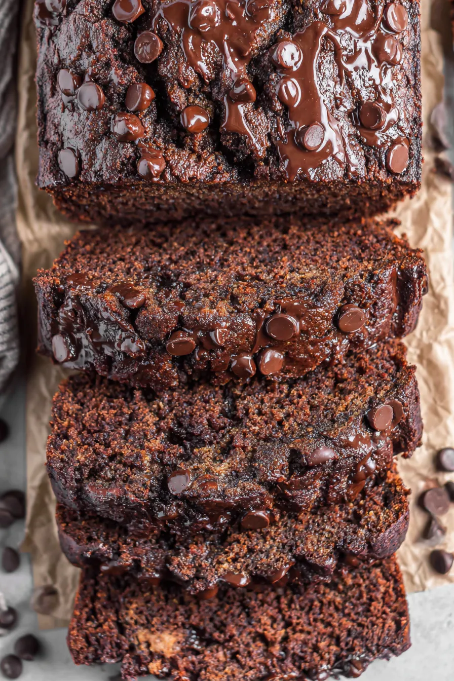 Sliced chocolate banana bread on cooling rack