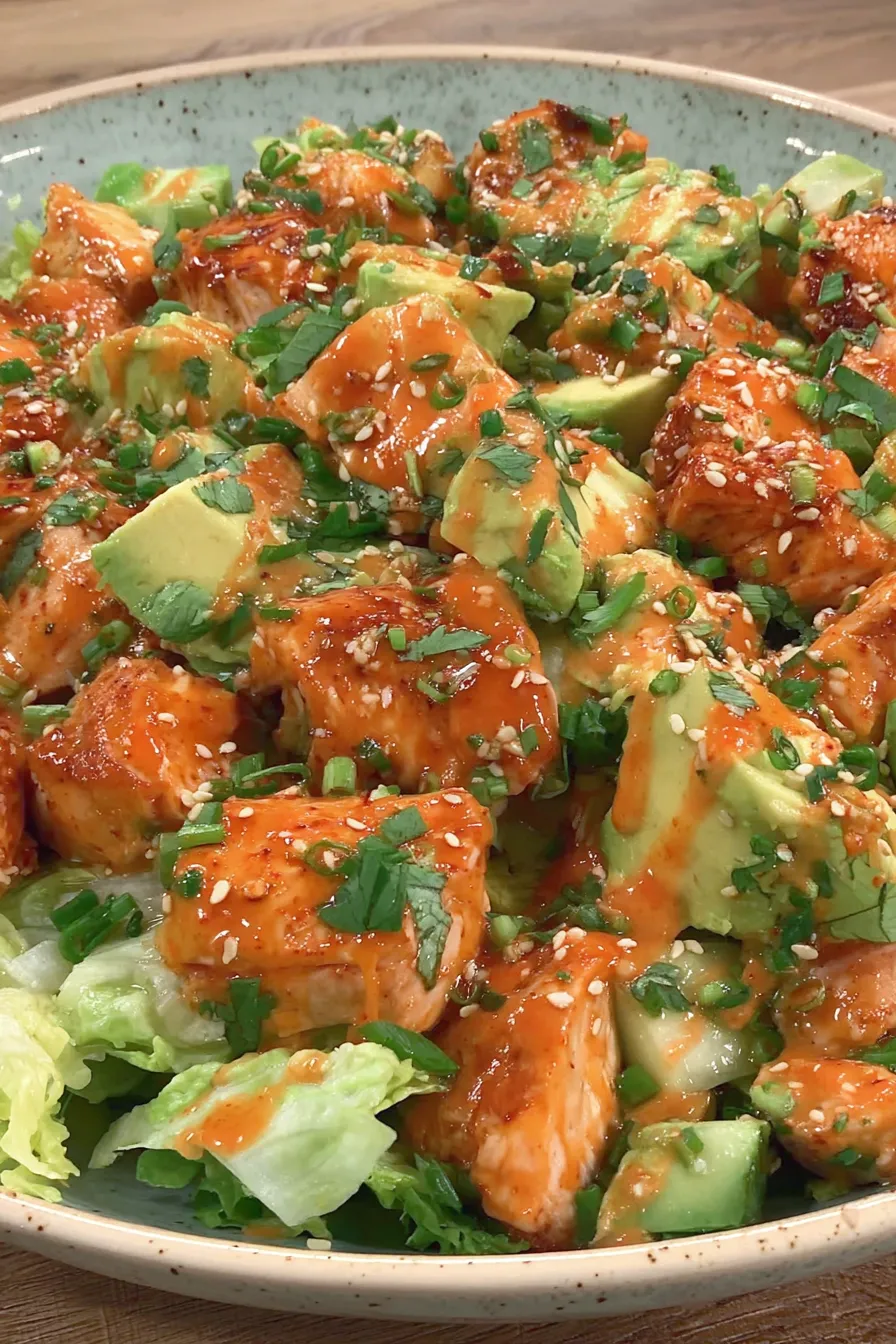 Close-up of sauced chicken and fresh herbs
