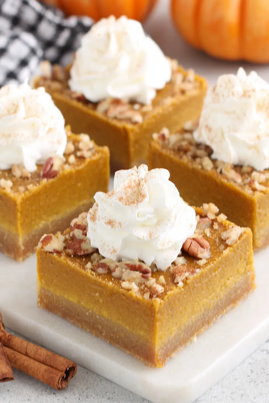 Pumpkin pie bars cooling on a wire rack