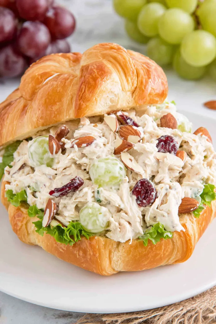 Chicken salad ingredients mixed in a bowl