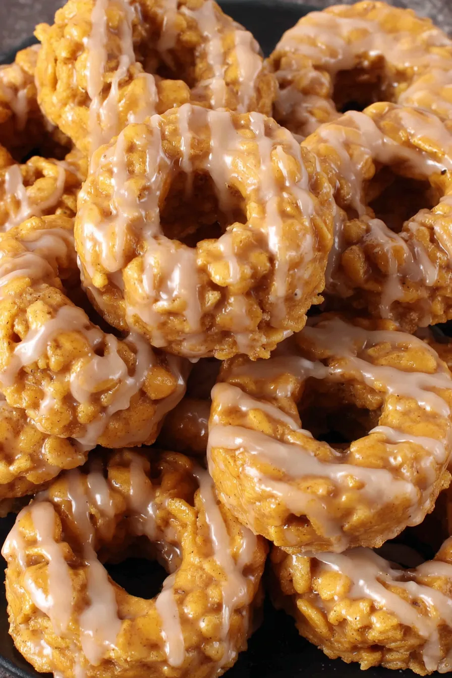 Pumpkin Rice Krispies donuts cooling in a pan