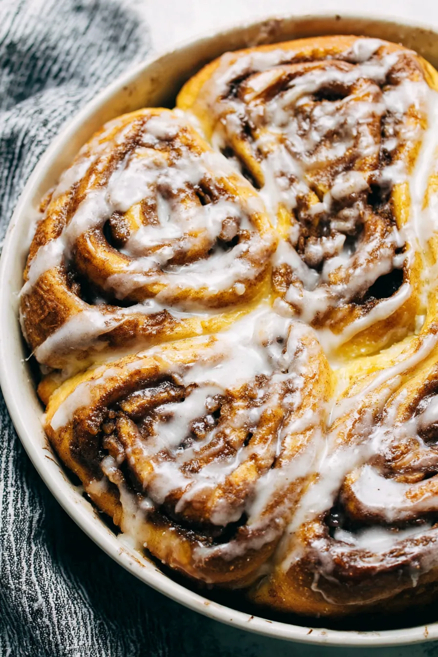 Cinnabon cinnamon roll cake in a 9x13 pan with glaze