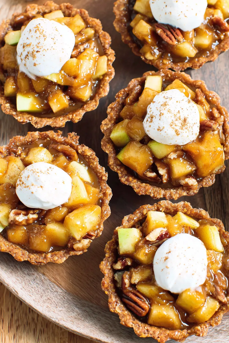 Close-up of tartlet with coconut whip and cinnamon