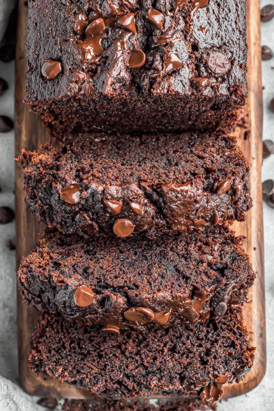 Loaf cooling on a wire rack with chocolate chips on top