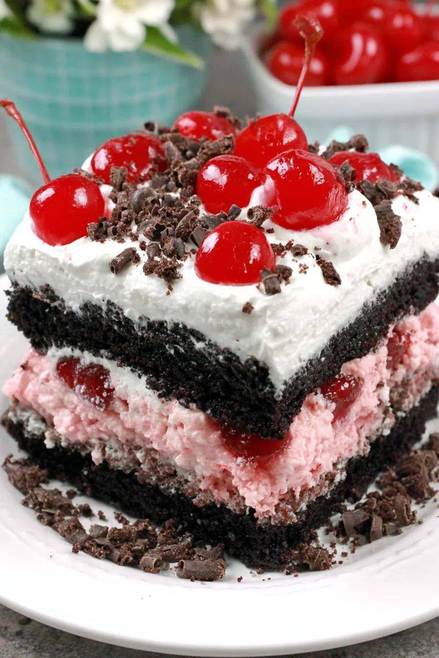 Slice of Chocolate Cherry Dr. Pepper Cake with cherries