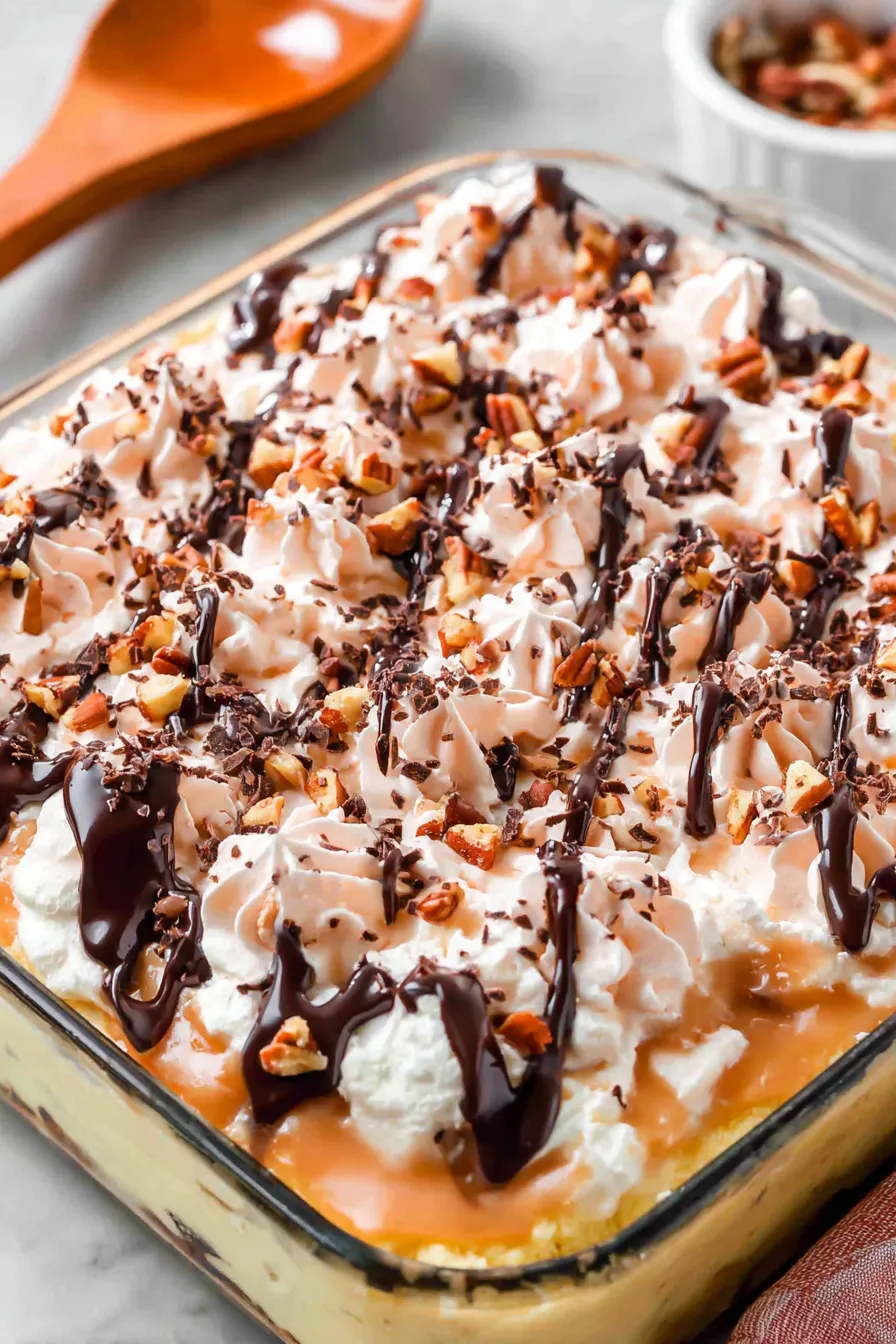 Baked turtle poke cake with caramel drizzles