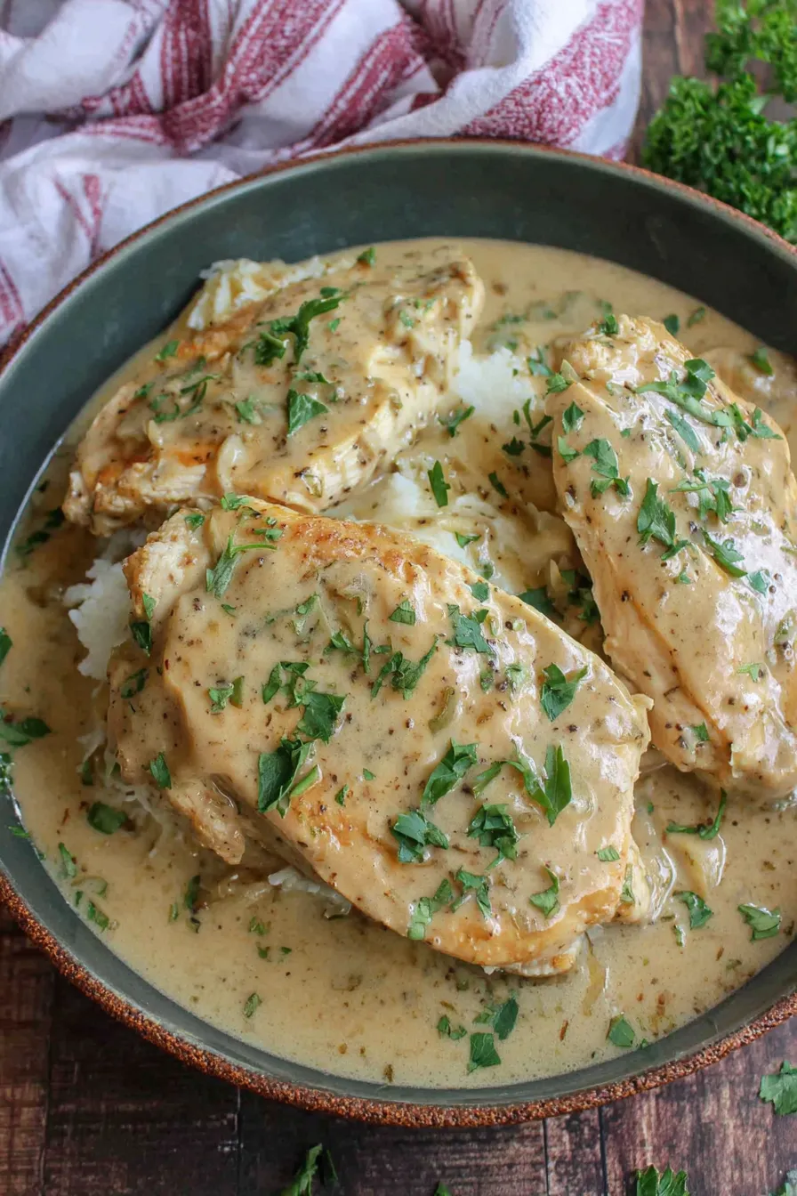 User provided content image 1 showing chicken in gravy in a slow cooker
