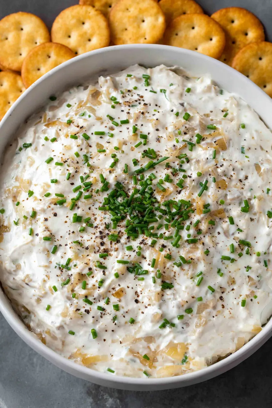 Creamy dip in a bowl with chives