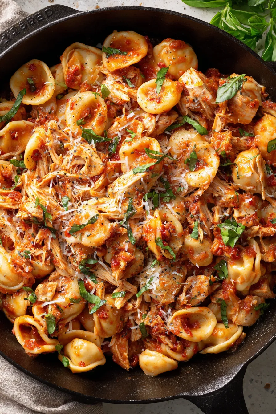 served orecchiette chicken fra diavolo plated with basil