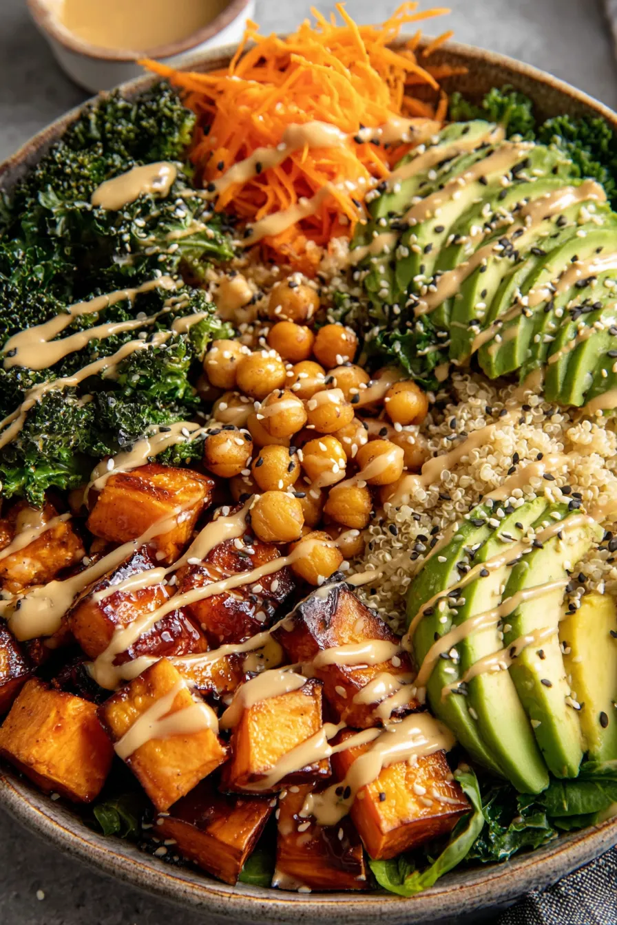 Assembled miso sweet potato bowl with avocado and sesame seeds