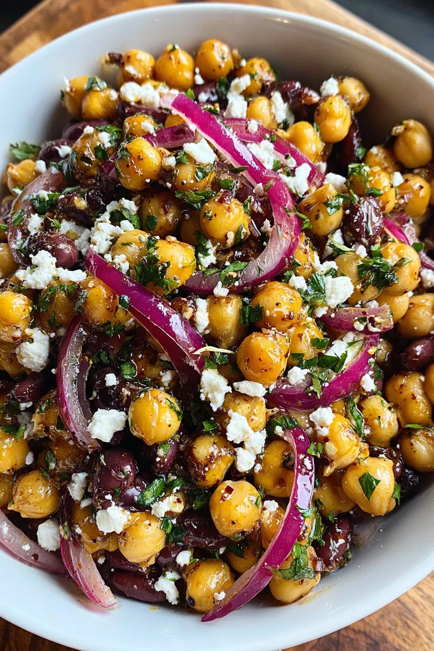 Bowl of bean salad with feta and parsley