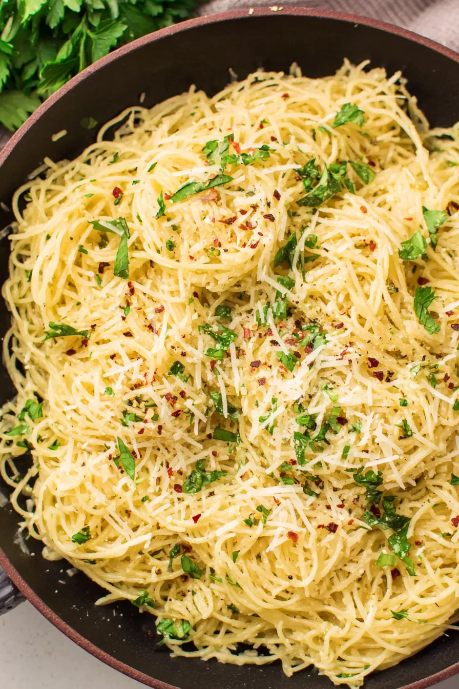 Parmesan noodles tossed in a skillet