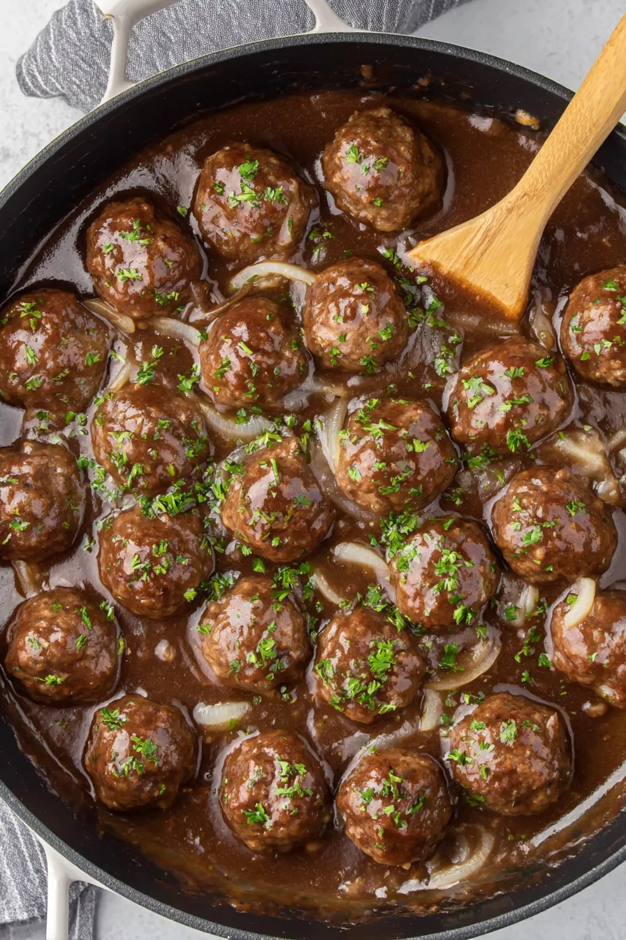 Serving suggestion: meatballs over mashed potatoes with parsley garnish