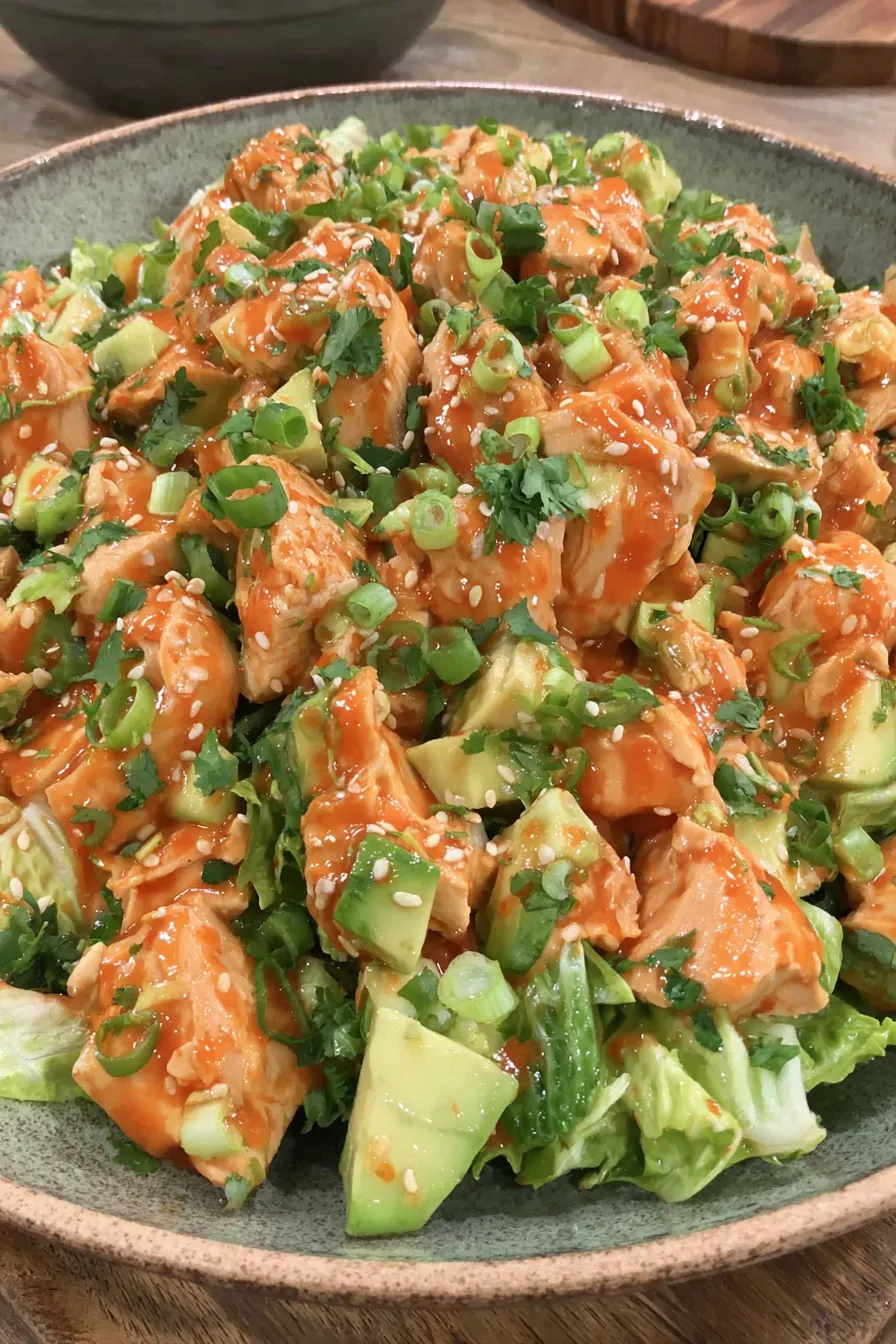 Korean BBQ chicken salad served in a bowl with sesame seeds and crushed peanuts