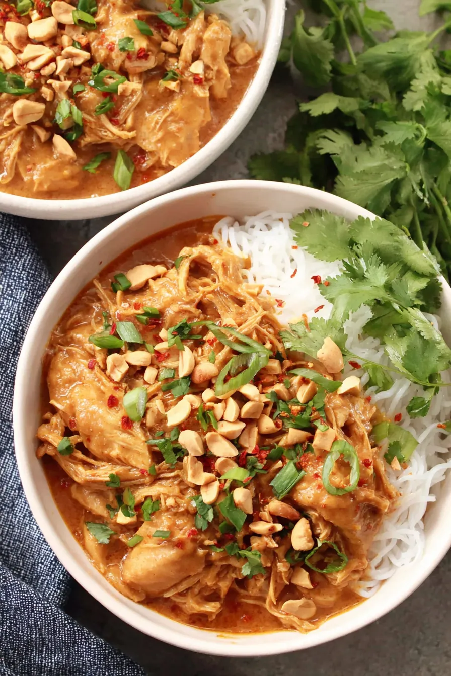 Serving suggestion: Thai peanut chicken over rice with cilantro and peanuts