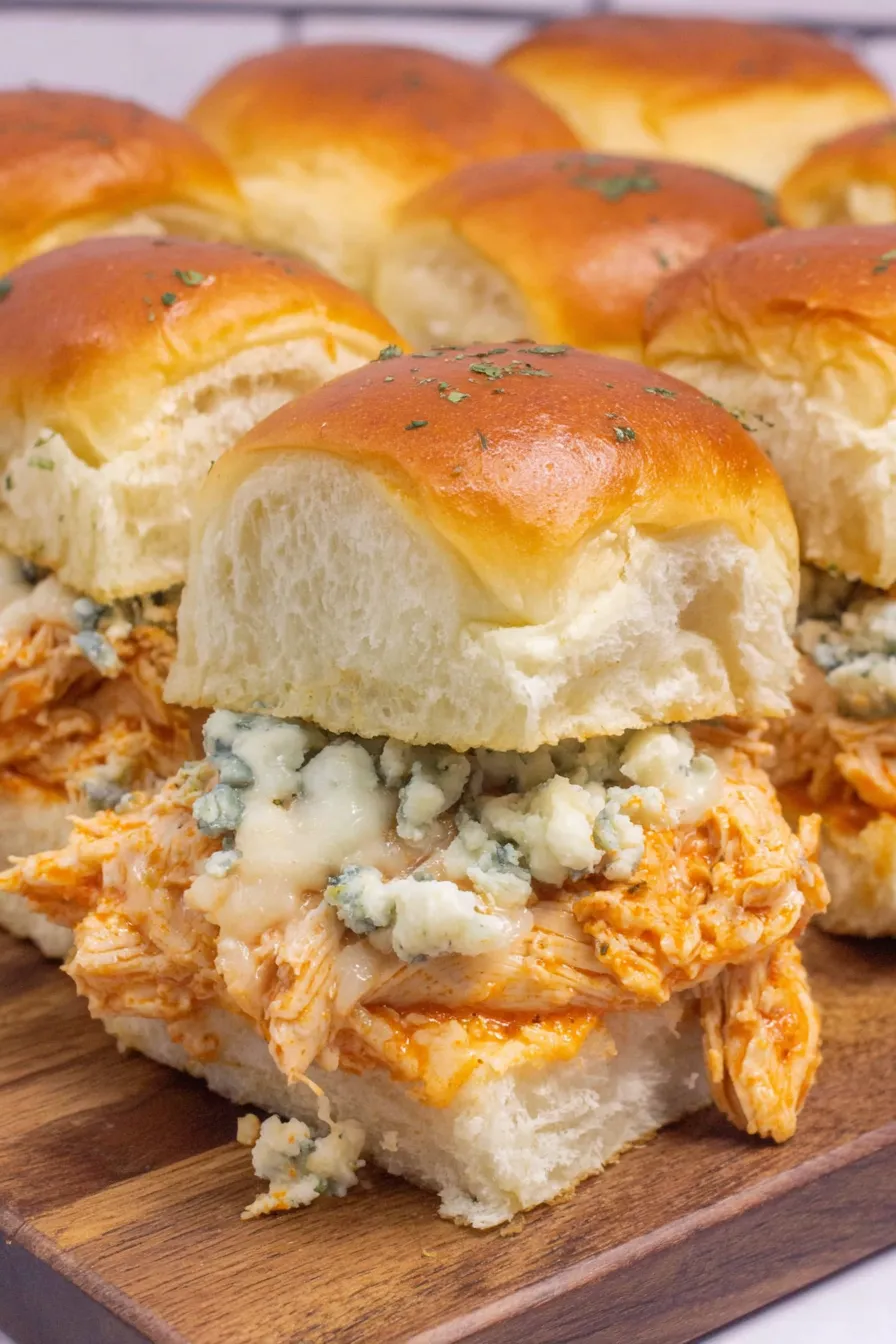 Buffalo chicken sliders on baking sheet