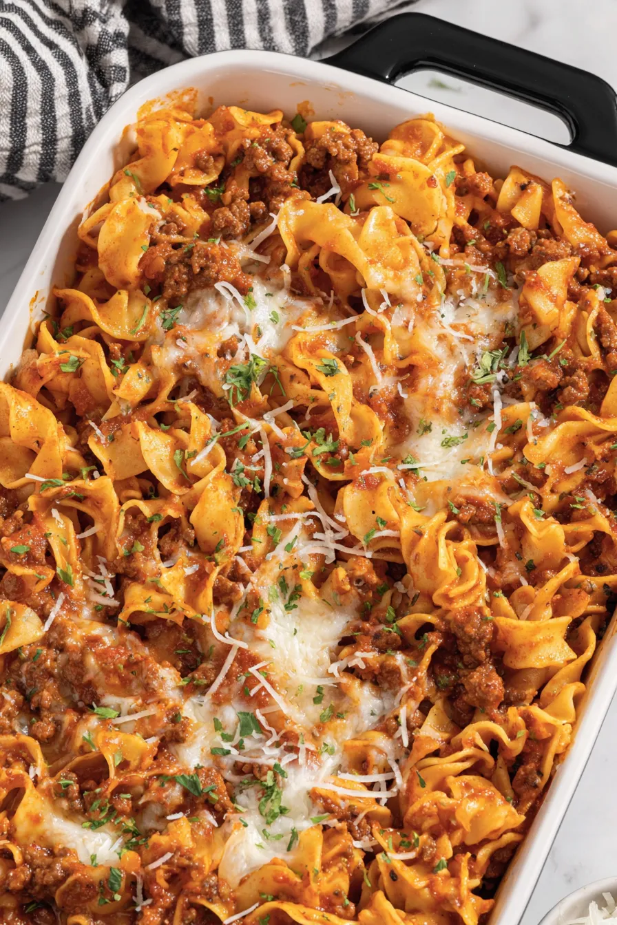 Creamy layer being spread over noodles