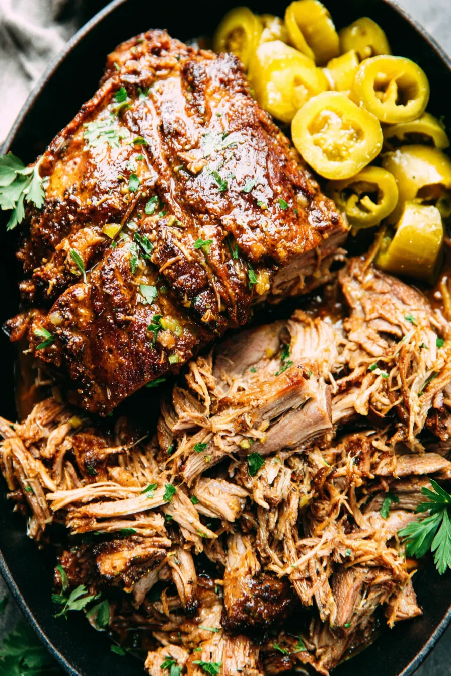 Slow cooker Mississippi pork roast in the insert with butter melting on top