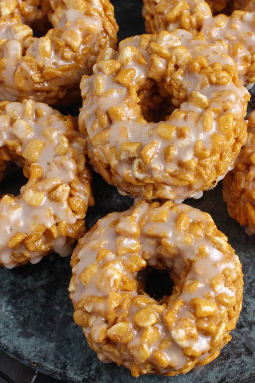 Glazed pumpkin cereal donuts on a plate