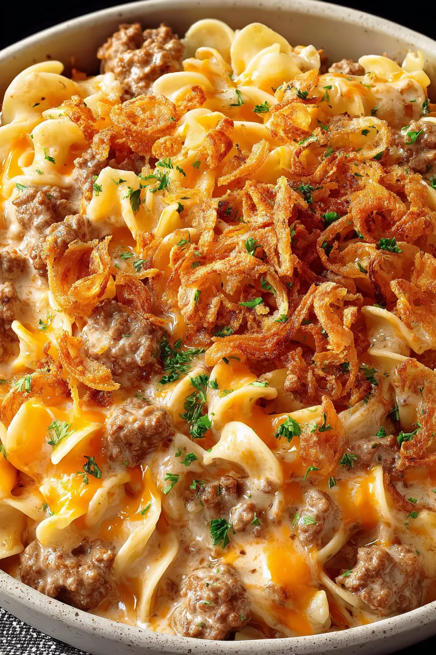 Cheesy beef and noodle casserole topped with crispy onions