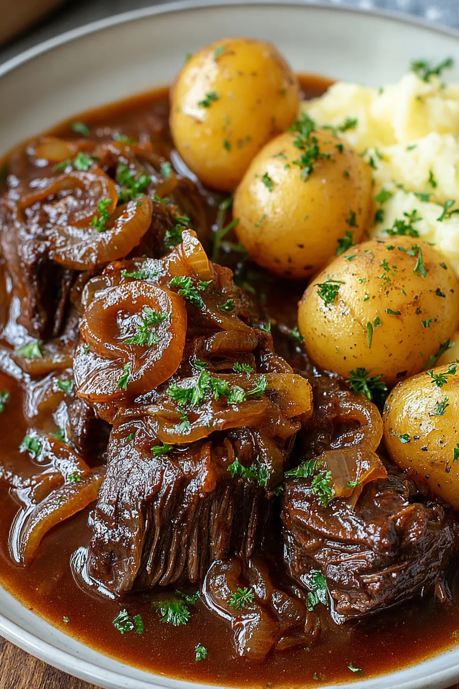 Slow cooker pot roast in ceramic cooker with onions