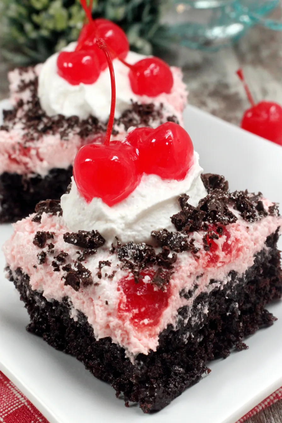 Close up of a slice showing cherry pieces and chocolate curls