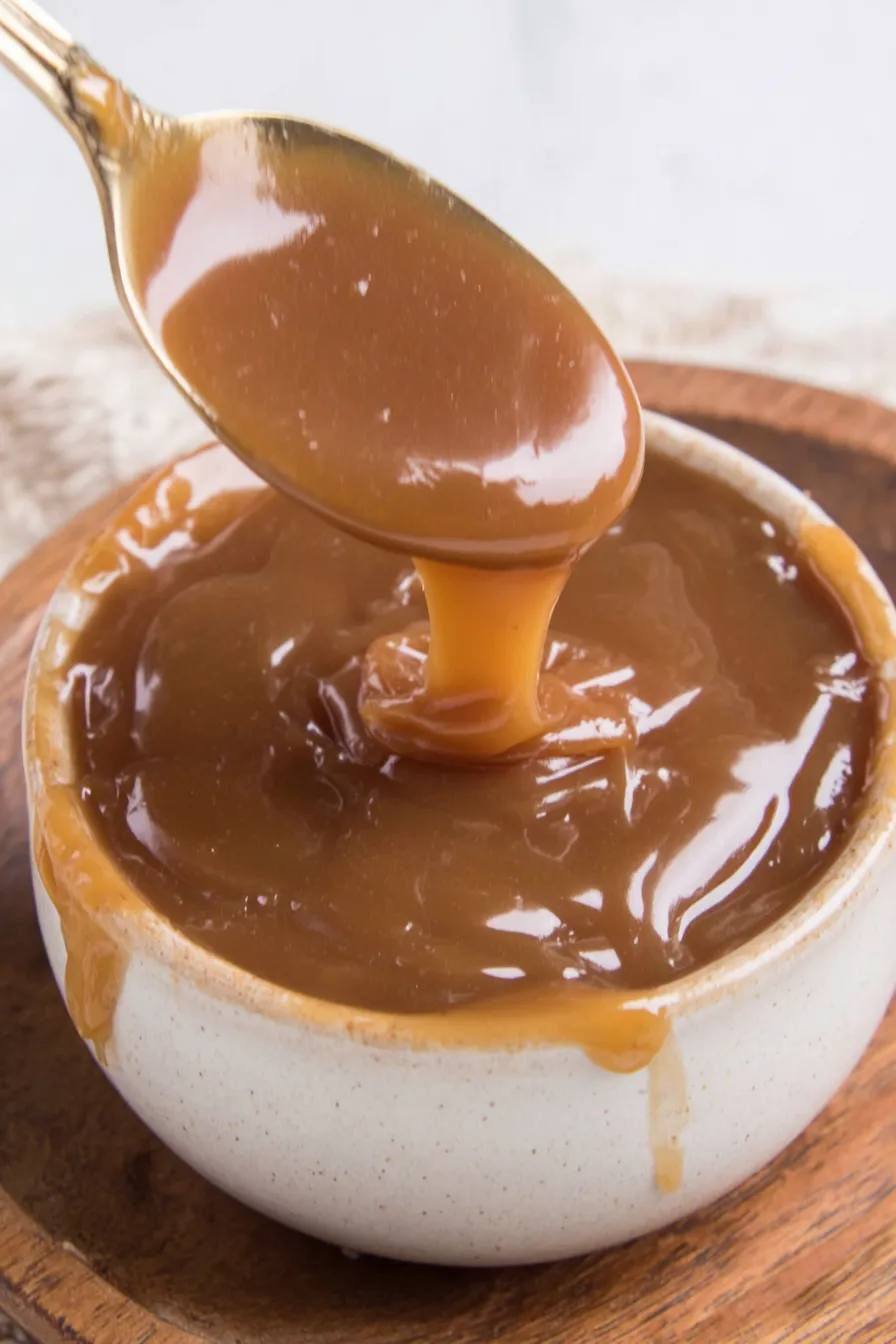 Close up of toffee sauce being drizzled