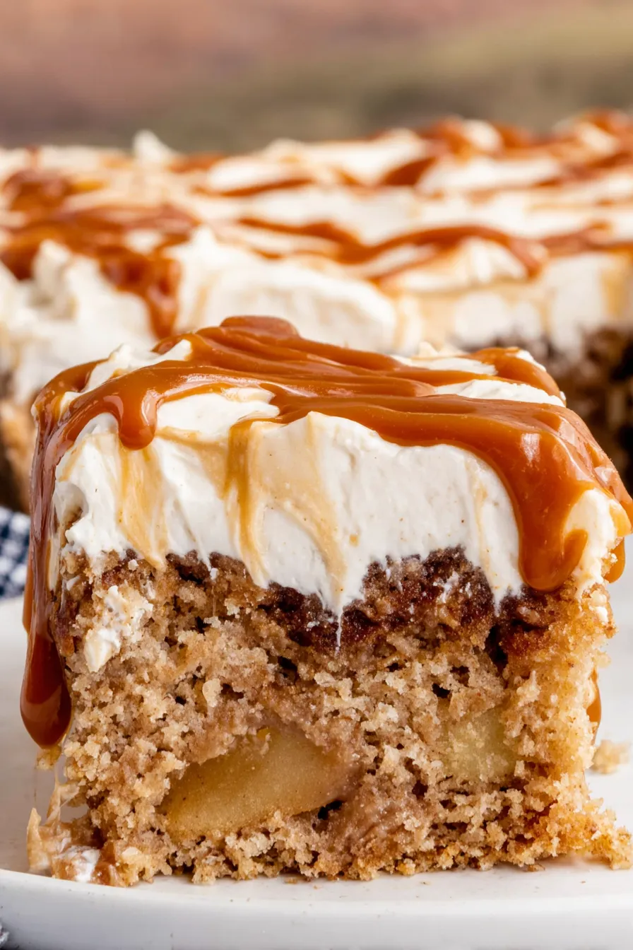 Sliced vegan apple cake with frosting and caramel