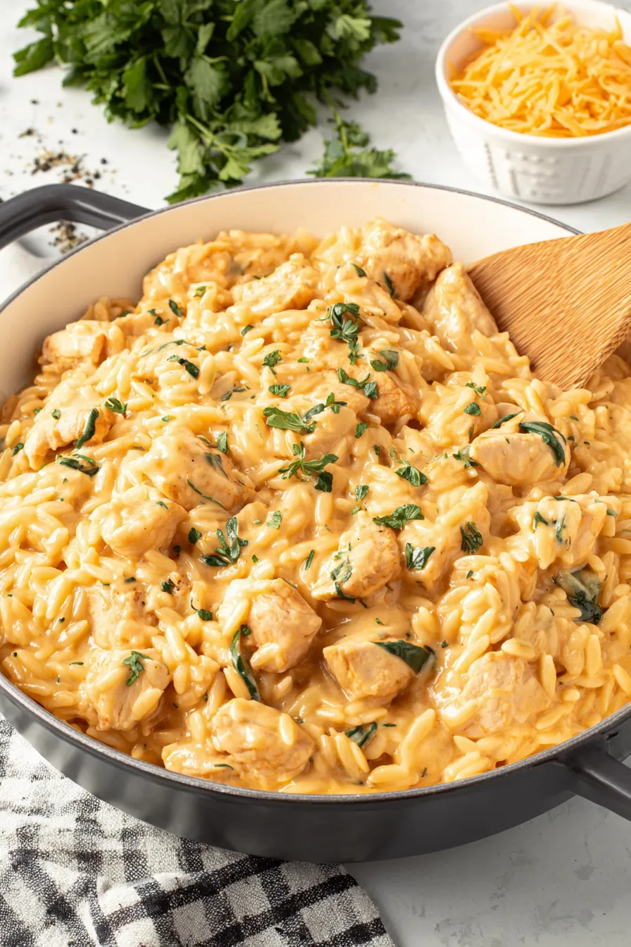Pan of creamy chicken orzo with spinach