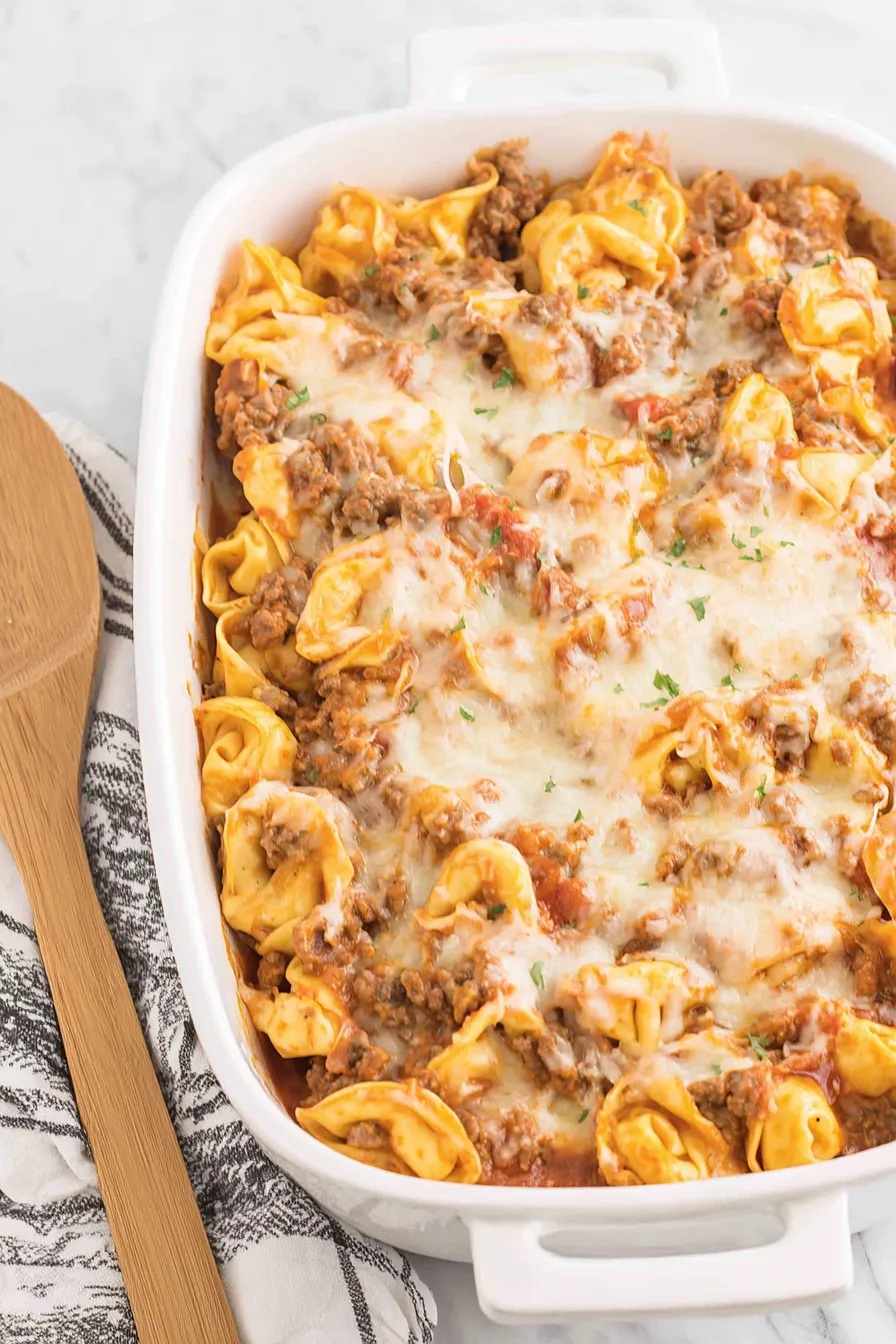 Baked tortellini in a baking dish with melted cheese