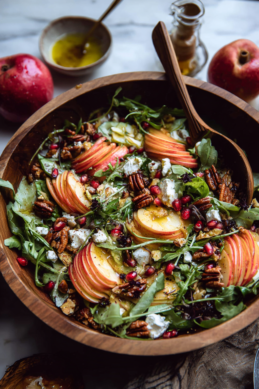Assembled apple feta salad with vinaigrette drizzle