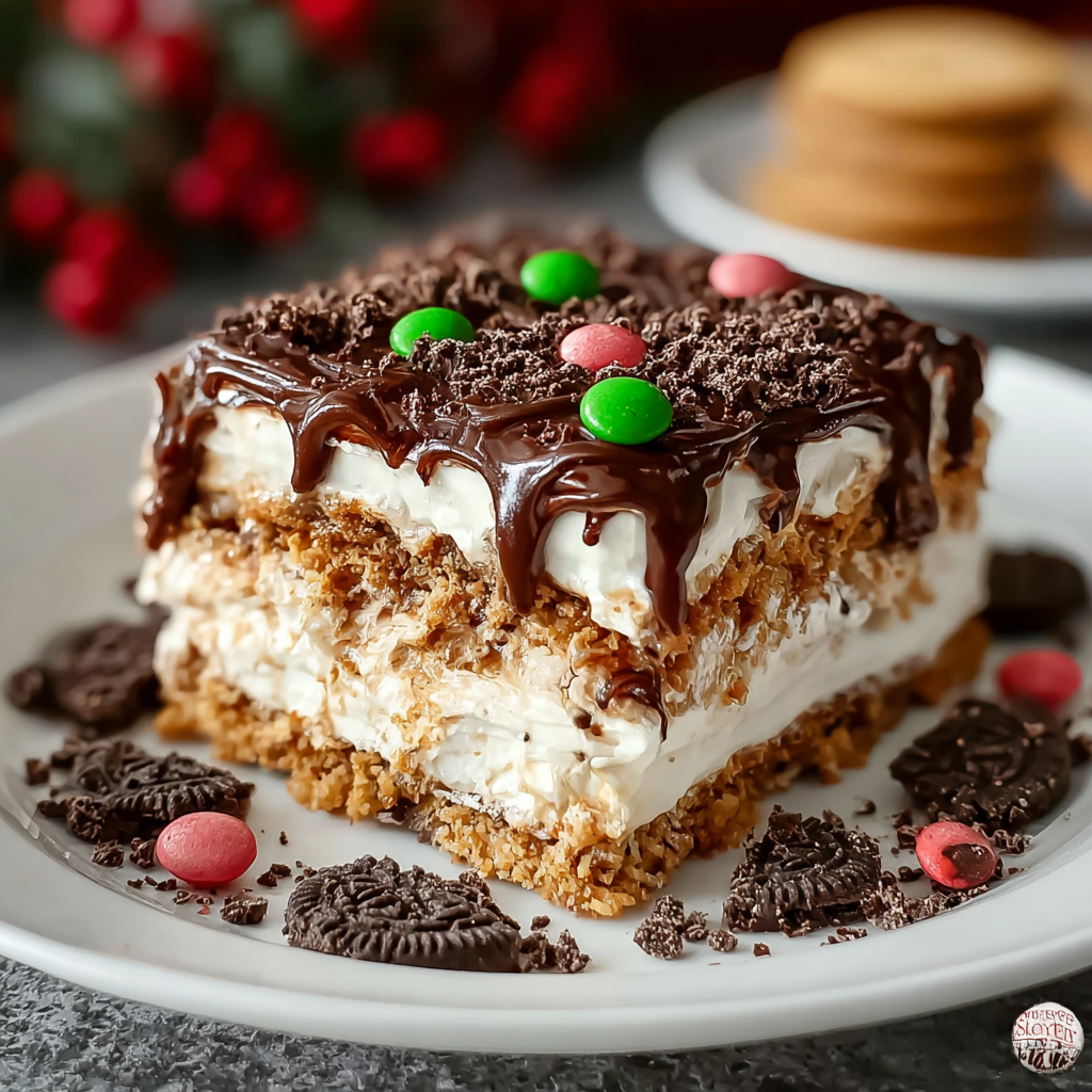 No-bake cookie lasagna layered in glass pan with sprinkles